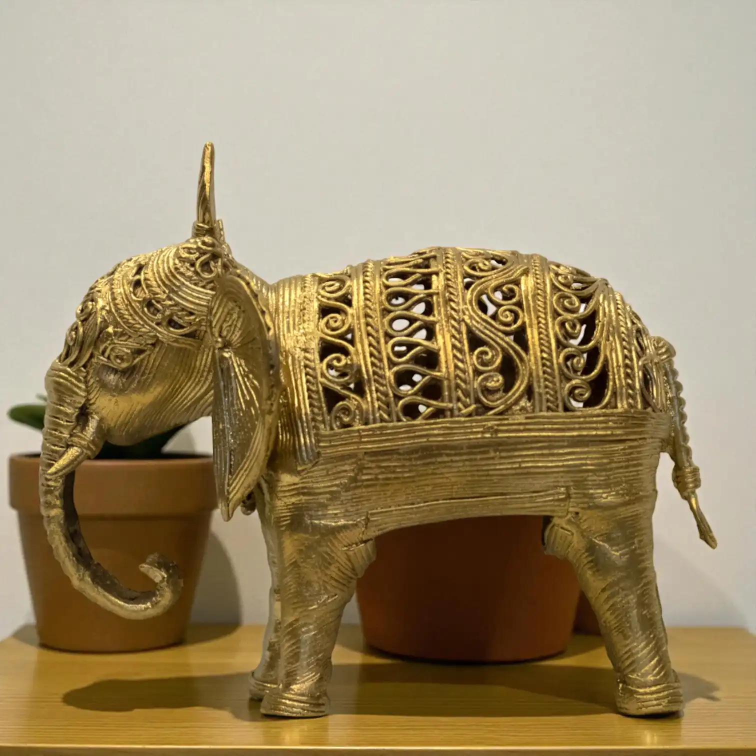 Left side view of big elephant dokra metal craft from Karuka.