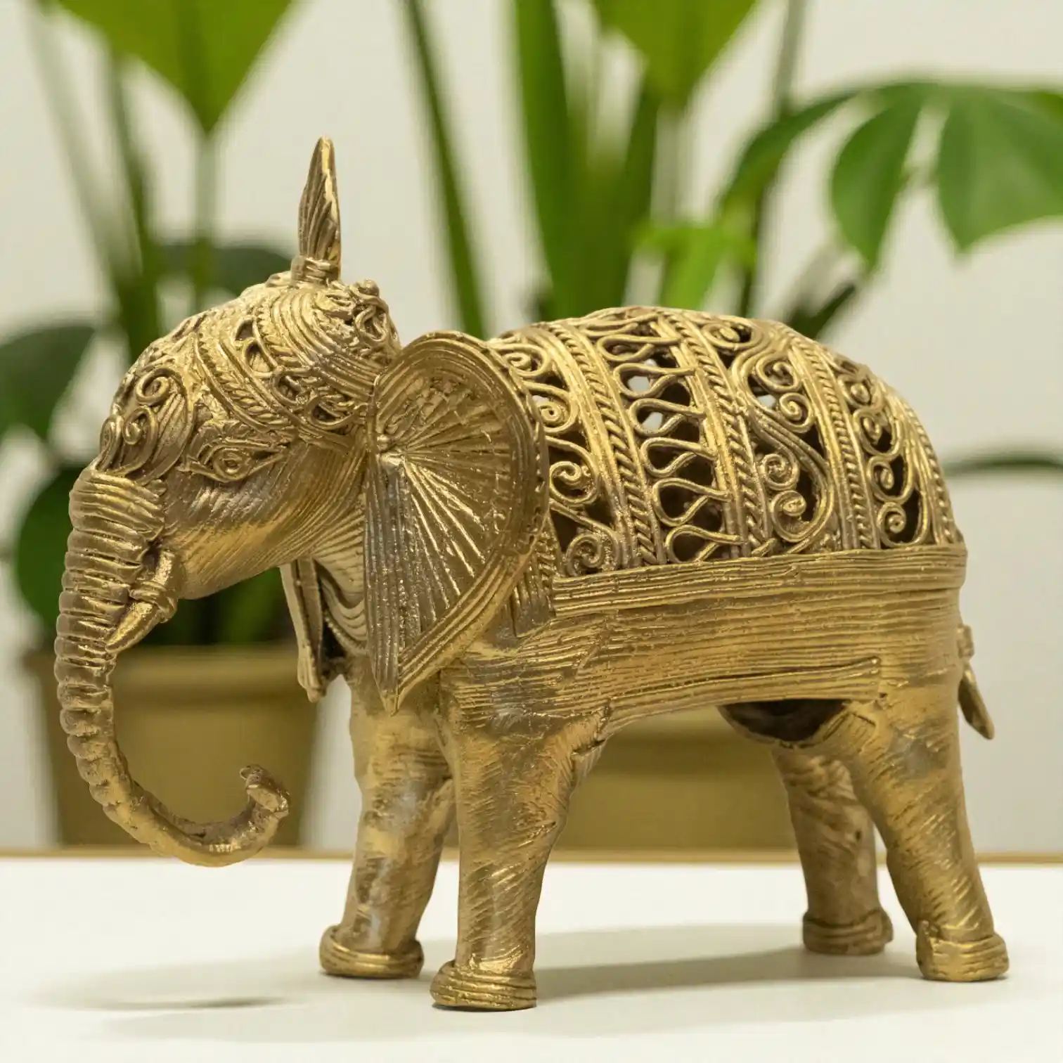 Angled left view of big elephant dokra metal craft from Karuka.