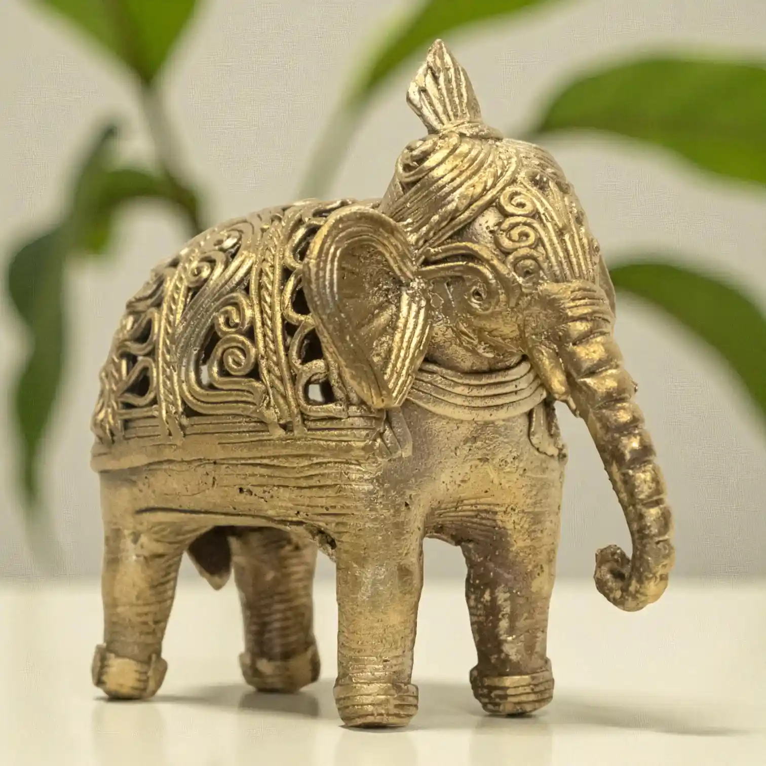 Left angle view of elephant dokra metal craft from Karuka.